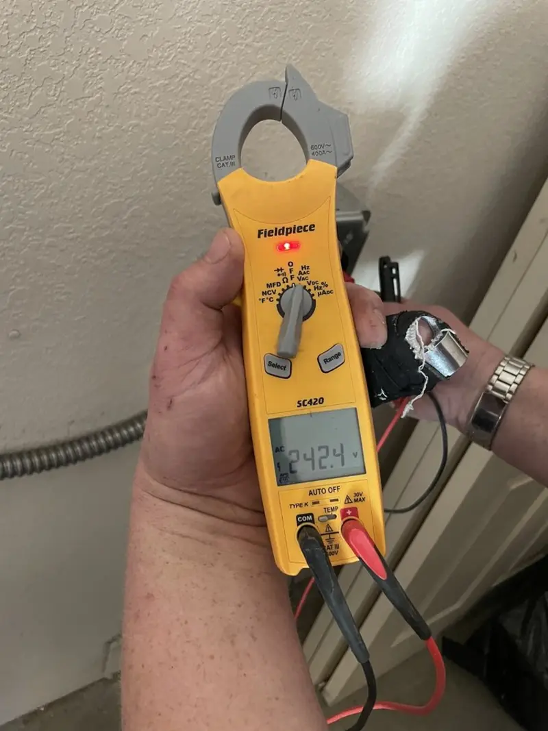 Voltage testing with clamp meter during Outlet Installation in Bakersfield